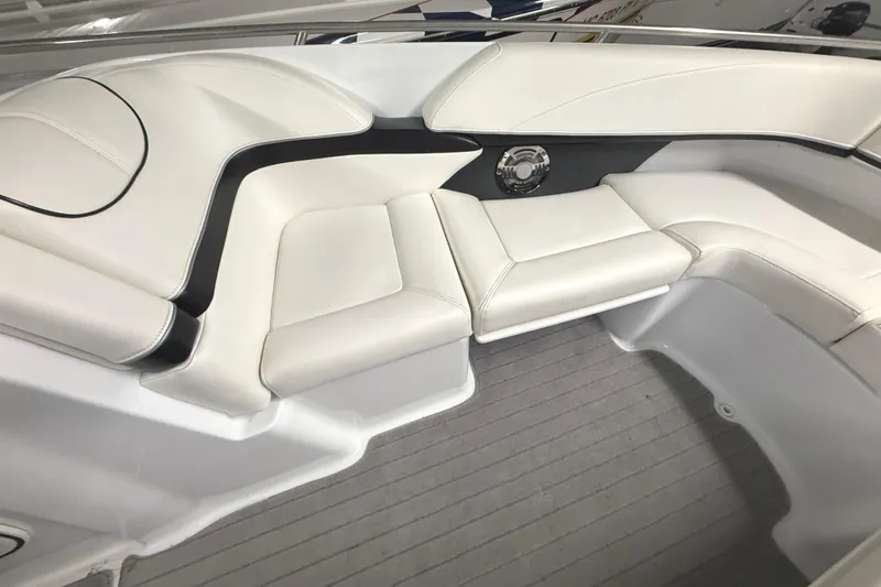 Slide: The Image of 2013 Formula 310 Bowrider interior with white leather seating and sleek design. - 11