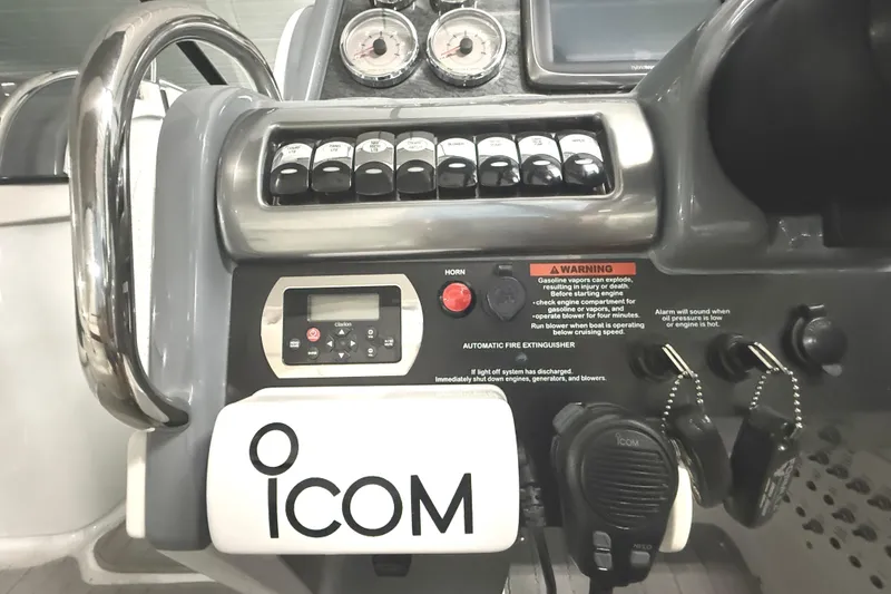 Slide: The Image of Control panel of a 2013 Formula 310 Bowrider boat with ICOM radio equipment. - 15