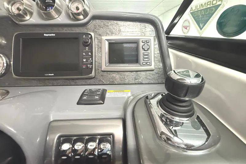 Slide: The Image of Control panel of a 2013 Formula 310 Bowrider with navigation screens and joystick. - 16