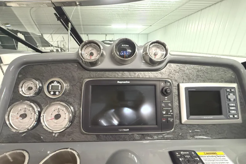 Slide: The Image of Dashboard of a 2013 Formula 310 Bowrider with navigation and control instruments. - 17