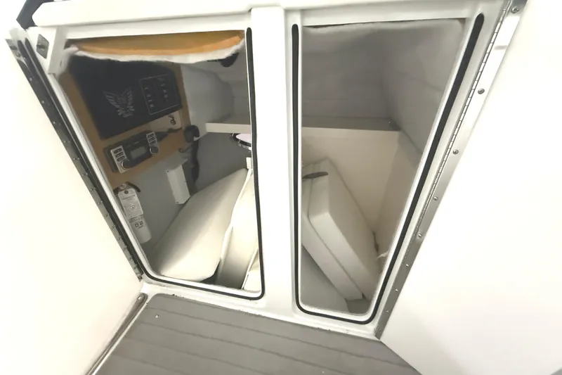 Slide: The Image of 2013 Formula 310 Bowrider cabin interior with seating and control panel. - 22