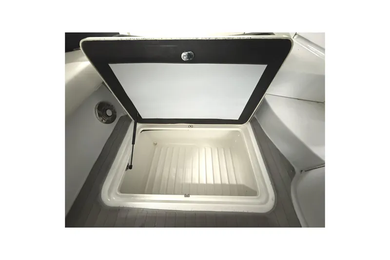 Slide: The Image of Open storage compartment on 2013 Formula 310 Bowrider boat, showcasing interior space. - 23