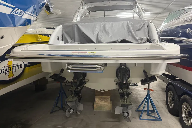 Slide: The Image of 2013 Formula 310 Bowrider boat in storage, rear view with covered deck. - 26