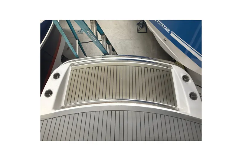 Slide: The Image of 2013 Formula 310 Bowrider boat deck, featuring sleek design and stainless steel accents. - 4