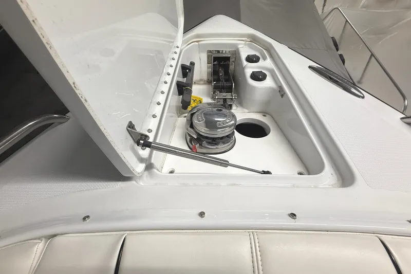 Slide: The Image of 2013 Formula 310 Bowrider anchor compartment with open hatch and winch system. - 7