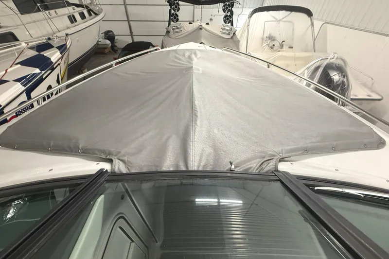 Slide: The Image of 2013 Formula 310 Bowrider with protective cover in storage. - 8