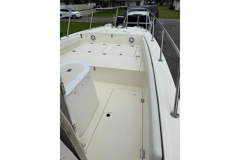 Slide: The Image of 1997 Sea Cat 255 boat deck with storage compartments and railing. - 10
