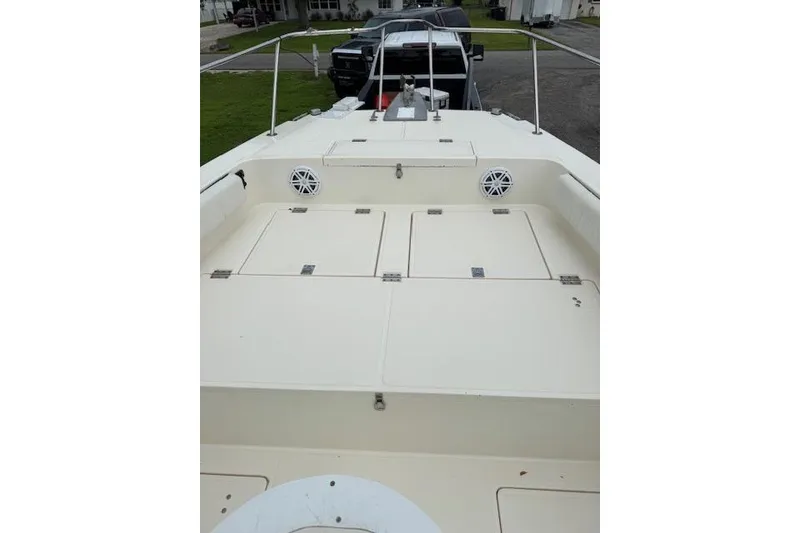 Slide: The Image of 1997 Sea Cat 255 boat deck with storage compartments and railing. - 11