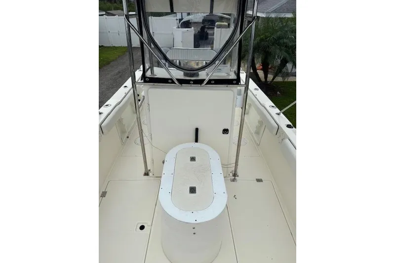Slide: The Image of 1997 Sea Cat 255 boat interior with center console and seating area. - 12