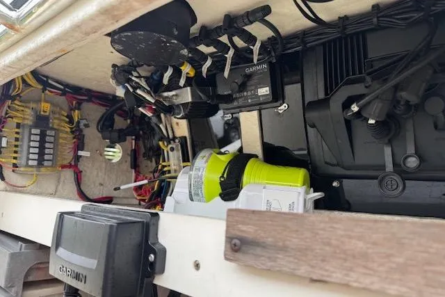 Slide: The Image of Interior view of a 1997 Sea Cat 255 boat showing electrical components and wiring. - 14