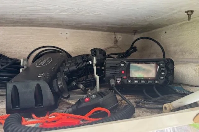 Slide: The Image of Marine radio equipment in a 1997 Sea Cat 255 boat storage compartment. - 16