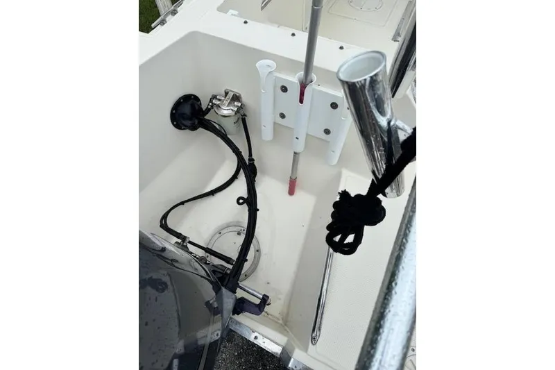 Slide: The Image of Interior view of a 1997 Sea Cat 255 boat, featuring equipment and storage compartments. - 7