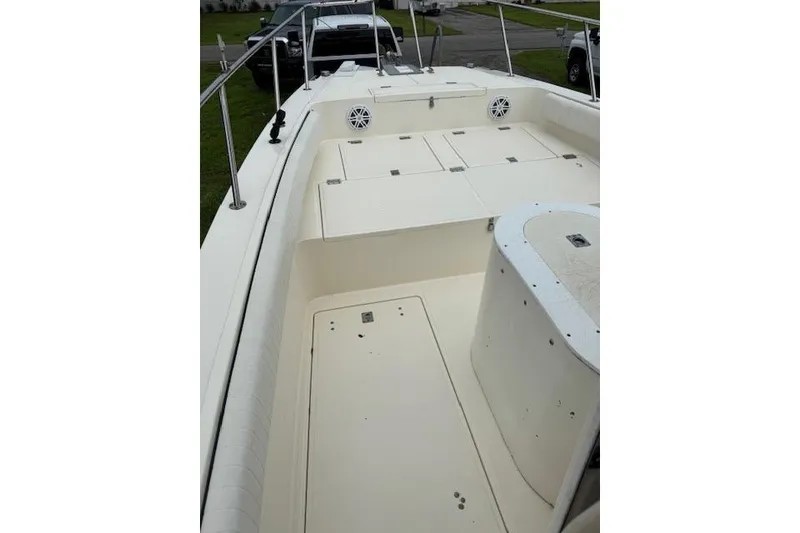 Slide: The Image of 1997 Sea Cat 255 boat deck with storage compartments and railing. - 9