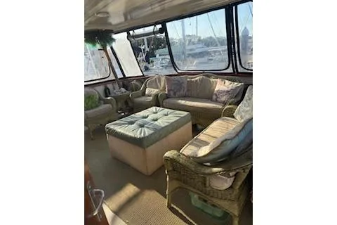 Slide: The Image of Interior of 1990 Californian 45 Motor Yacht with comfortable seating and large windows. - 10
