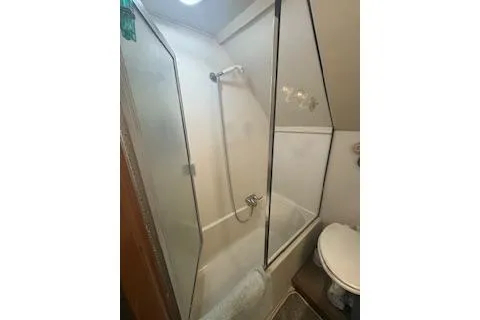 Slide: The Image of Bathroom with shower and toilet in 1990 Californian 45 Motor Yacht. - 15