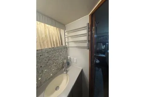 Slide: The Image of Bathroom interior of 1990 Californian 45 Motor Yacht with sink and towel rack. - 16