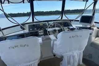 Slide: The Image of 1990 Californian 45 Motor Yacht cockpit with dual seats and navigation equipment. - 19