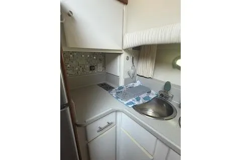 Slide: The Image of 1990 Californian 45 Motor Yacht kitchen with sink, countertop, and backsplash. - 28