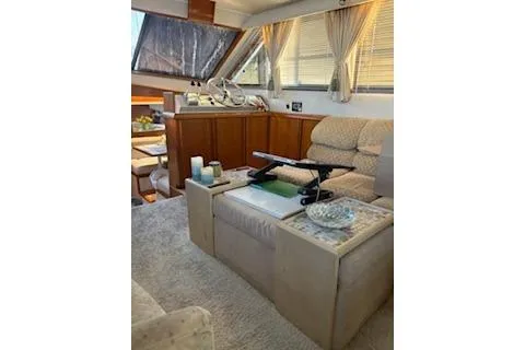 Slide: The Image of Interior of 1990 Californian 45 Motor Yacht with cozy seating and elegant decor. - 30