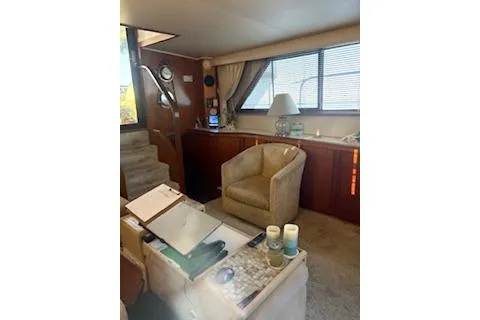 Slide: The Image of Interior of 1990 Californian 45 Motor Yacht with cozy seating and elegant decor. - 33