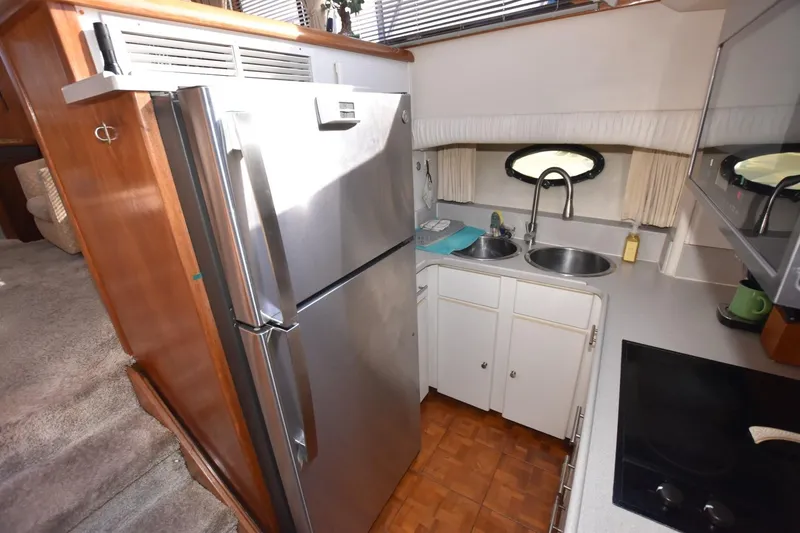 Slide: The Image of Compact kitchen in a 1990 Californian 45 Motor Yacht with stainless steel appliances. - 39