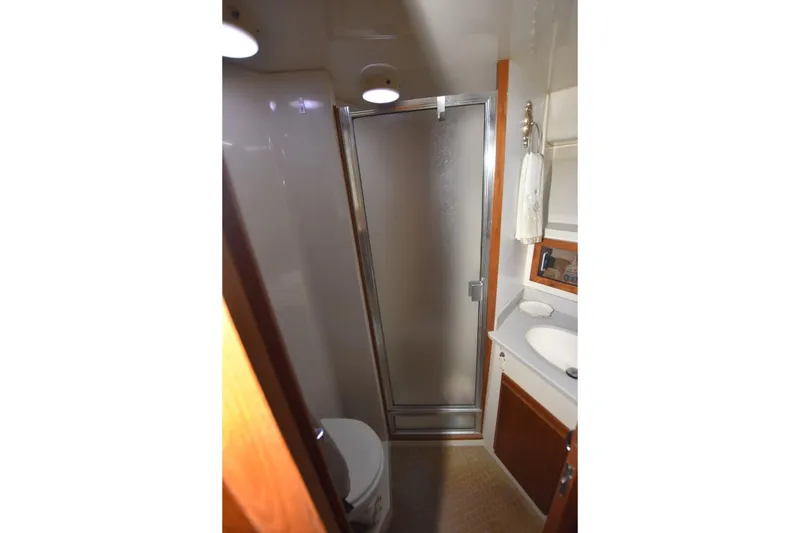 Slide: The Image of Bathroom interior of 1990 Californian 45 Motor Yacht with shower and sink. - 43