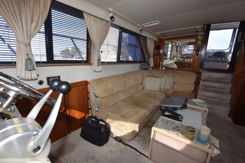 Slide: The Image of Interior of 1990 Californian 45 Motor Yacht with beige sofa and nautical decor. - 44
