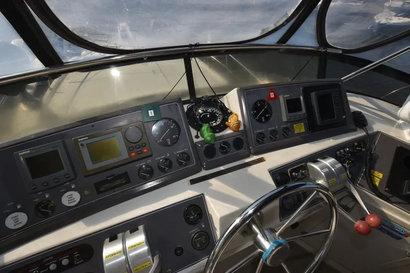 Slide: The Image of Control panel of a 1990 Californian 45 Motor Yacht with navigation instruments. - 56