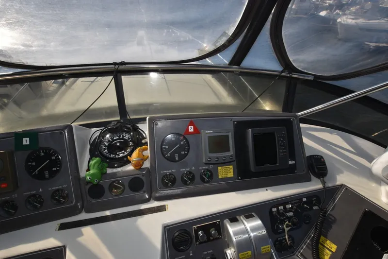 Slide: The Image of Cockpit of 1990 Californian 45 Motor Yacht with navigation instruments and controls. - 57