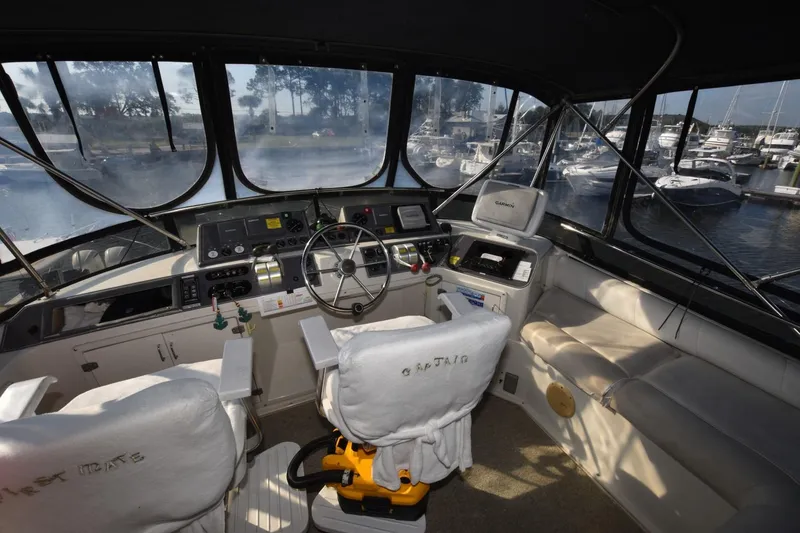 Slide: The Image of Interior view of 1990 Californian 45 Motor Yacht cockpit with steering wheel and navigation equipment. - 61