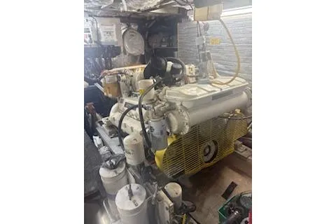 Slide: The Image of Engine room of a 1990 Californian 45 Motor Yacht, showcasing mechanical components. - 70