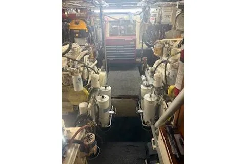 Slide: The Image of Engine room of a 1990 Californian 45 Motor Yacht, showcasing machinery and equipment. - 75