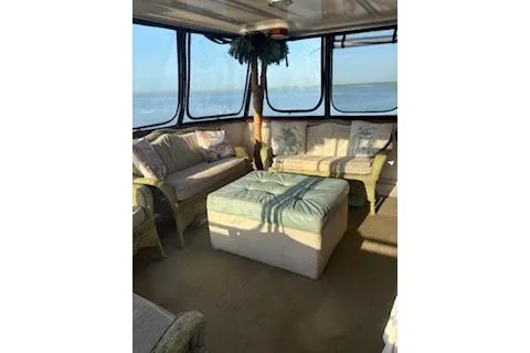 Slide: The Image of Interior of 1990 Californian 45 Motor Yacht with cozy seating and large windows. - 9