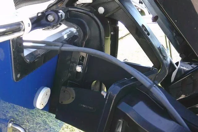 Slide: The Image of 2023 Carolina Skiff 26 Ultra Elite boat engine components and wiring close-up. - 10