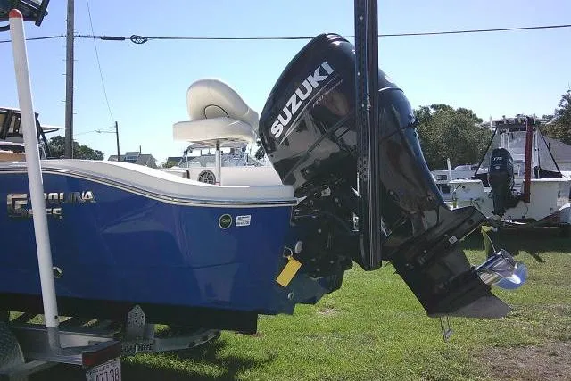 Slide: The Image of 2023 Carolina Skiff 26 Ultra Elite with Suzuki outboard motor on display. - 12