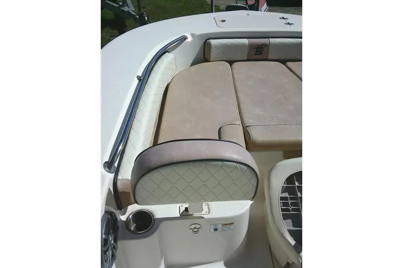 Slide: The Image of 2023 Carolina Skiff 26 Ultra Elite boat interior with cushioned seating and cup holder. - 17