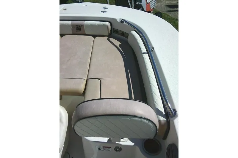 Slide: The Image of 2023 Carolina Skiff 26 Ultra Elite boat interior with cushioned seating and stainless steel railing. - 18