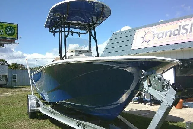 Slide: The Image of 2023 Carolina Skiff 26 Ultra Elite boat on trailer, parked outdoors. - 2