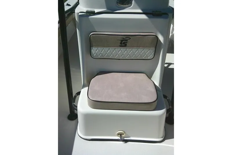 Slide: The Image of 2023 Carolina Skiff 26 Ultra Elite boat seat with cushioned backrest and storage. - 21