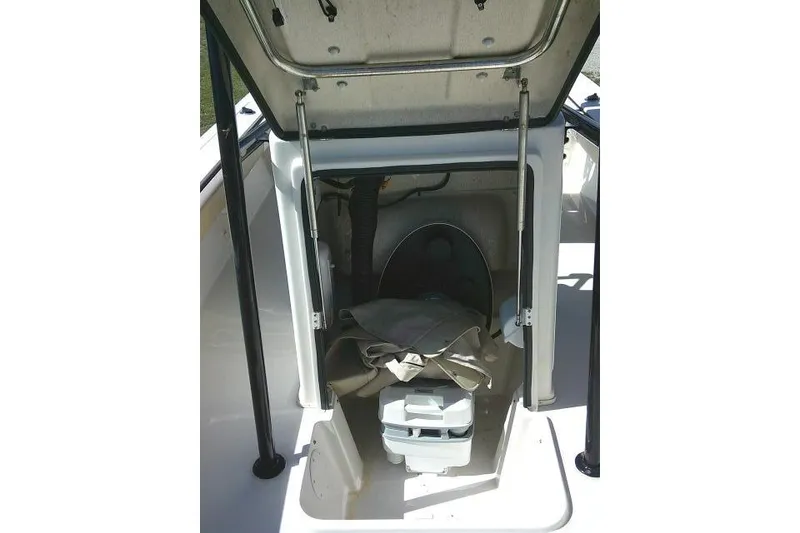 Slide: The Image of 2023 Carolina Skiff 26 Ultra Elite boat storage compartment with open hatch. - 25