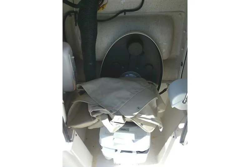 Slide: The Image of Interior of 2023 Carolina Skiff 26 Ultra Elite boat with storage compartment. - 27