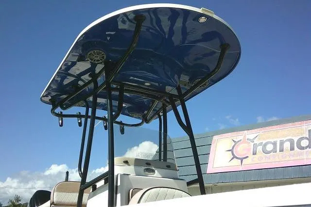 Slide: The Image of 2023 Carolina Skiff 26 Ultra Elite boat with T-top against blue sky. - 3