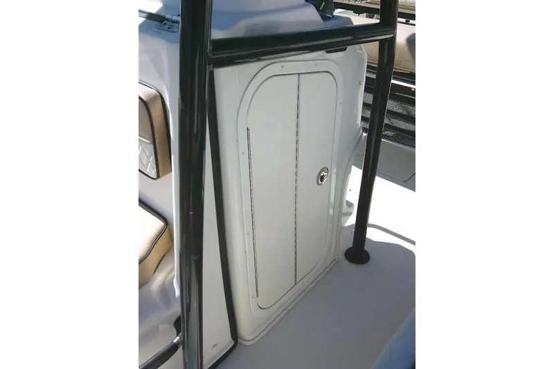 Slide: The Image of 2023 Carolina Skiff 26 Ultra Elite boat storage compartment with secure door and sleek design. - 30