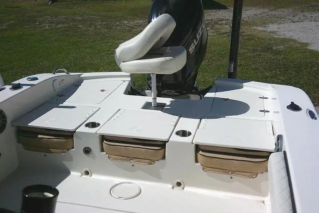 Slide: The Image of 2023 Carolina Skiff 26 Ultra Elite boat interior with seating and storage compartments. - 32