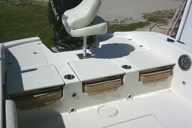 Slide: The Image of 2023 Carolina Skiff 26 Ultra Elite boat deck with seating and storage compartments. - 39