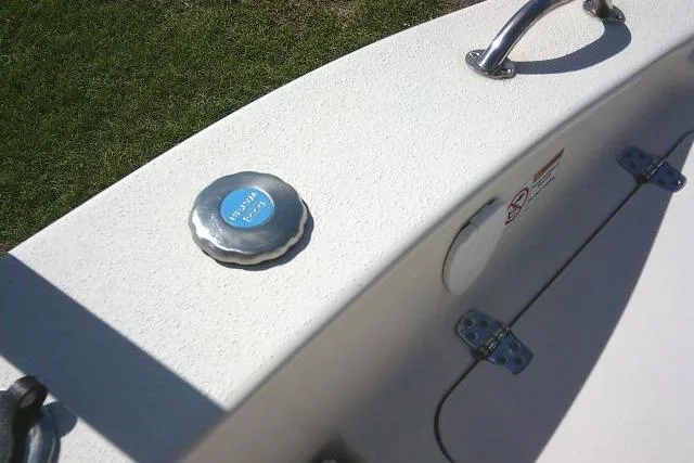 Slide: The Image of 2023 Carolina Skiff 26 Ultra Elite boat detail with fuel cap and handle. - 40