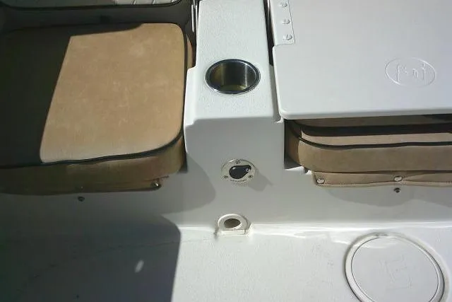 Slide: The Image of 2023 Carolina Skiff 26 Ultra Elite boat interior with cushioned seating and cup holder. - 43