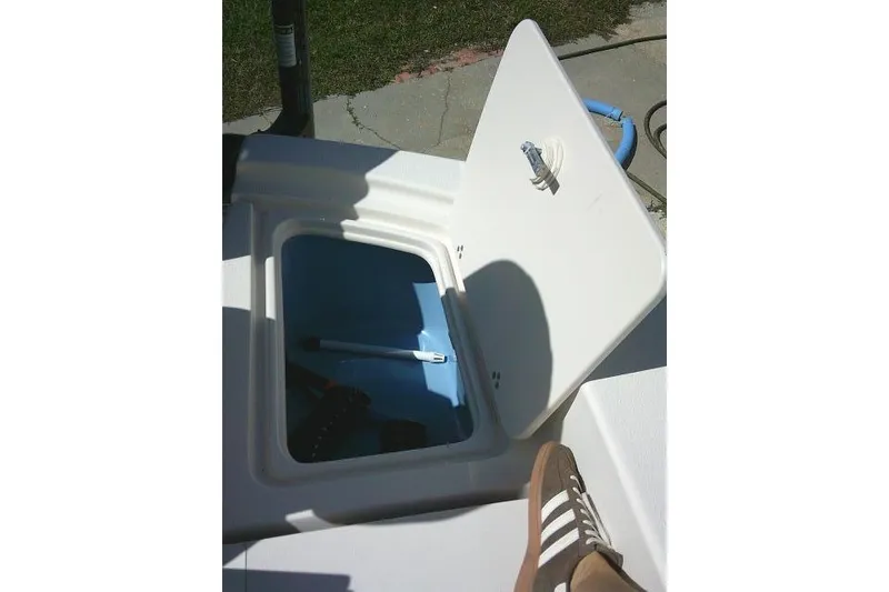 Slide: The Image of Open storage compartment on 2023 Carolina Skiff 26 Ultra Elite boat. - 45