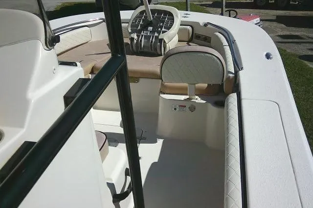 Slide: The Image of 2023 Carolina Skiff 26 Ultra Elite boat interior with seating and steering wheel. - 49