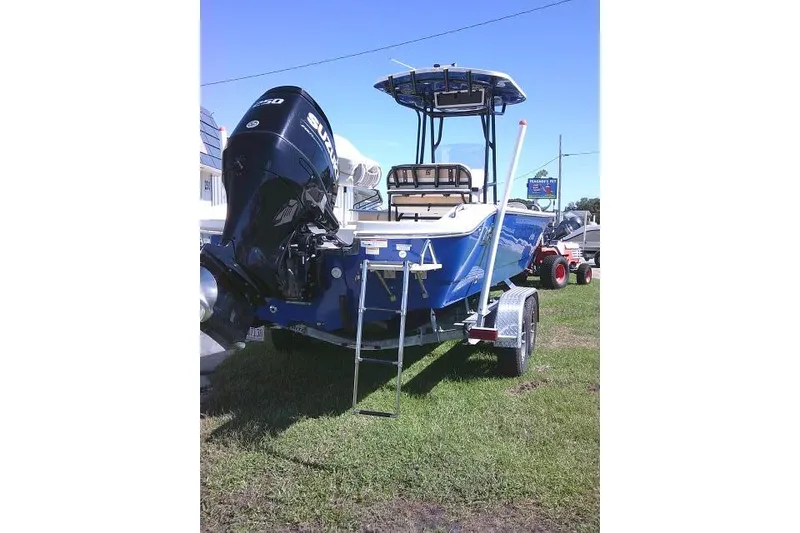 Slide: The Image of 2023 Carolina Skiff 26 Ultra Elite boat on trailer, featuring Suzuki outboard motor. - 6